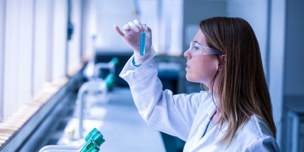 Scientist looking at test tube in the laboratory at the university